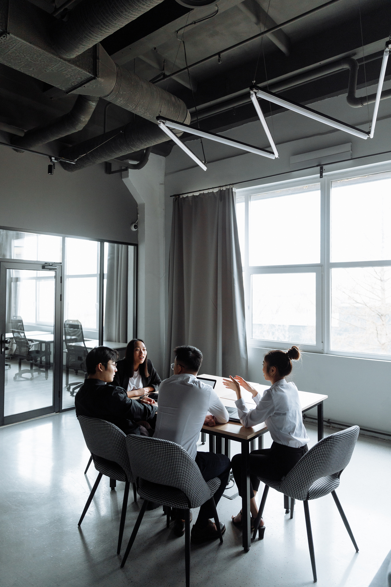 Business People Talking at Each Other Inside a Room